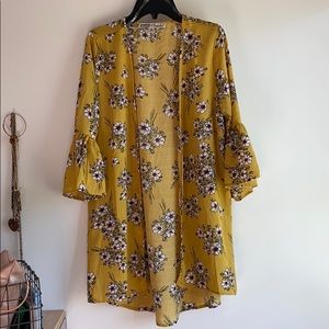 a light, yellow, airy, cardigan